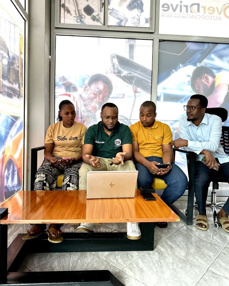 The DukaSuite team training a client's staff on a laptop